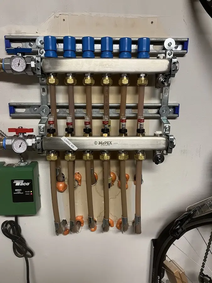 Plumber performing Water Heater Repair at a residential property in Eaton Rapids